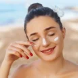 beauty-woman-smile-applying-sun-cream-face-skincare-body-sun-protection-sunscreen-beauty-woman-smile-applying-sun-cream-face-150388651